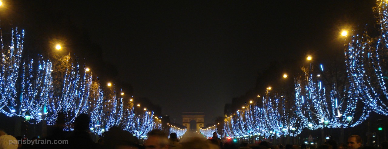 Avenue Champs-Elysées on New Year's Eve looking with trees lit from Concorde 