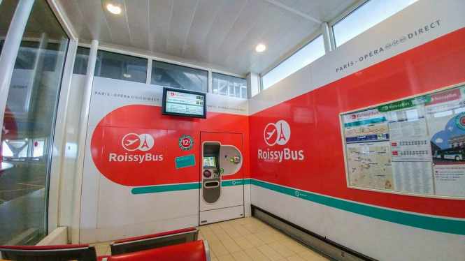 Roissybus ticket machine and next buses display inside waiting area CDG Terminal 1